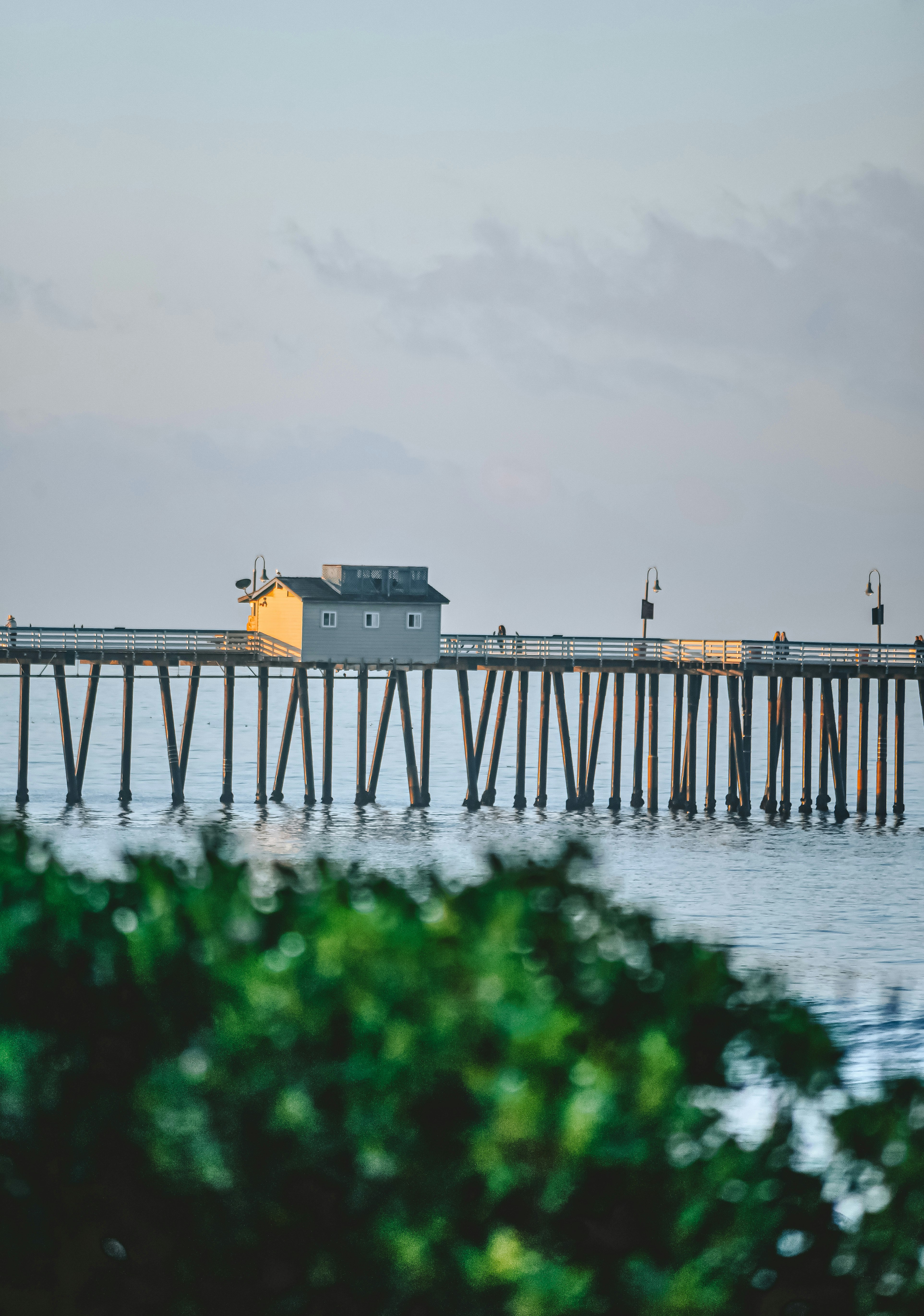 yellow and white house on dock during daytime